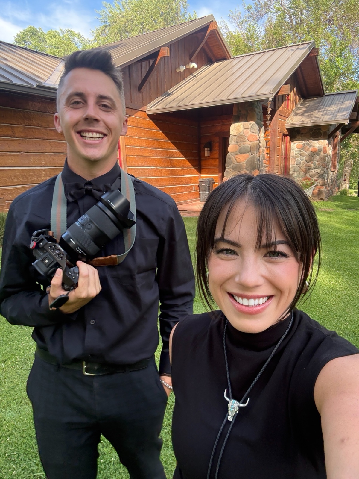 Two wedding filmmakers with a camera at an Arizona venue
