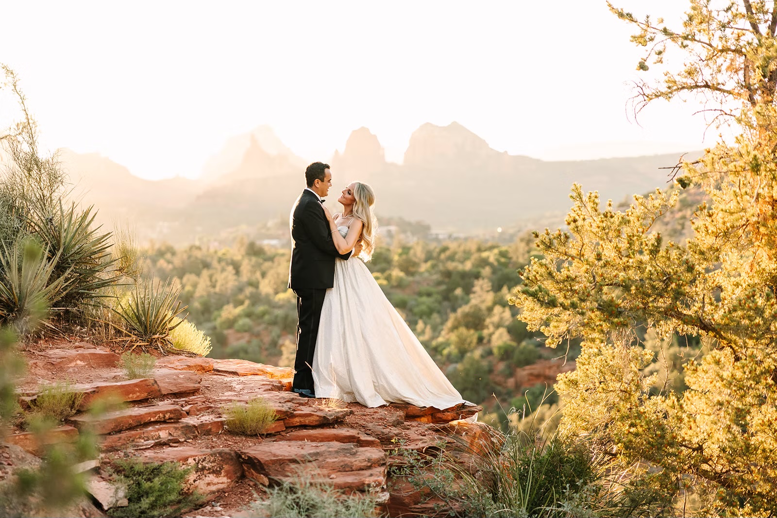 Newlyweds overlooking the red rocks at their Sedona, Arizona wedding